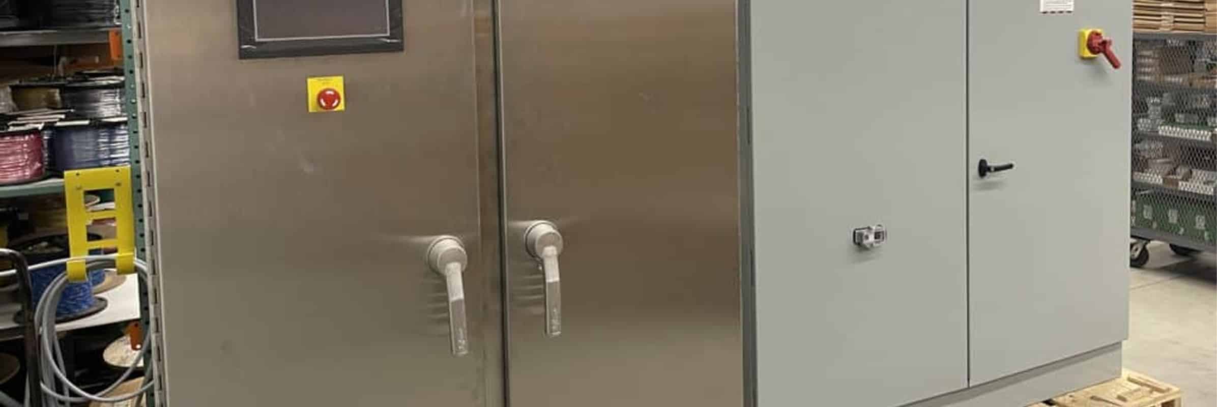 Stainless steel and painted steel electrical enclosures side by side